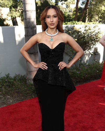 Andy Allo wearing a dramatic black evening gown