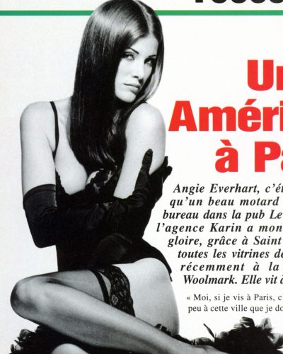 Angie Everhart black gloves paired with lace bodysuit.