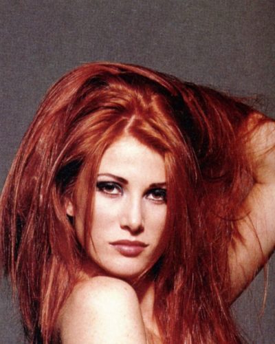 Angie Everhart black bodysuit styled with classic gloves.