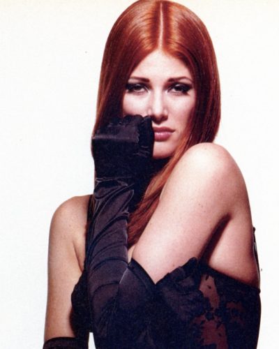 Angie Everhart black lace jumpsuit with plunging neckline