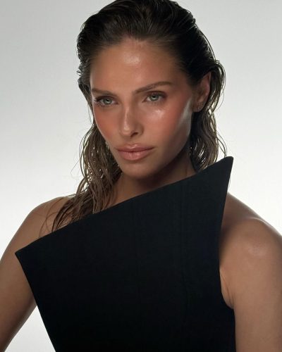 Anna Maria Olbrych in a black cocktail dress with unique patterns