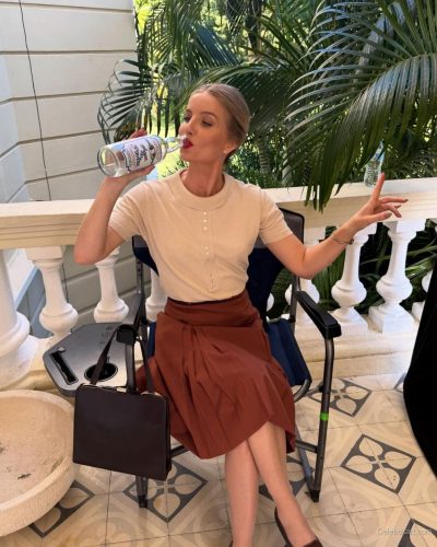 Annabelle Wallis styled in a black tee and chic trousers