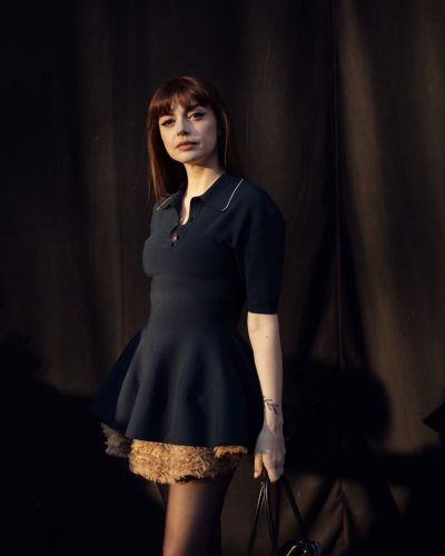 Annalisa styled with oversized cat-eye sunglasses and long hair.