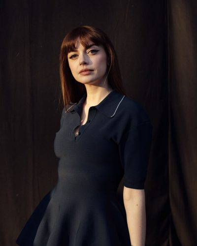 Annalisa black heels elongate her legs with navy dress.