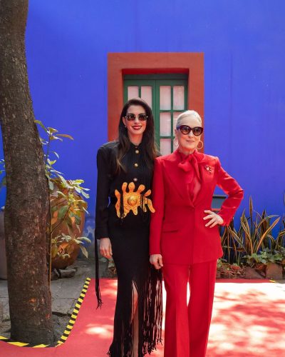 Anne Hathaway black dress with golden fringe and soft waves