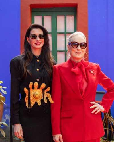 Anne Hathaway tailored black dress with sleek black sunglasses