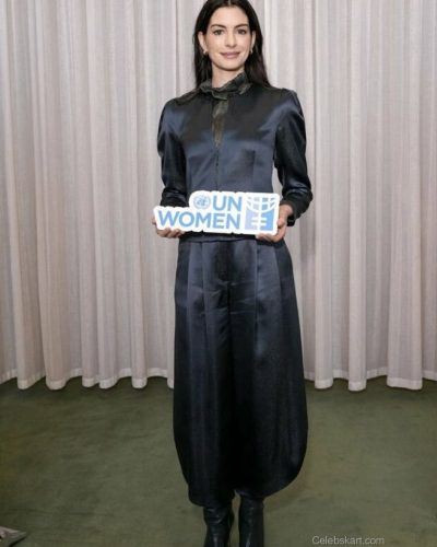 Anne Hathaway elegant teal dress with a fitted silhouette