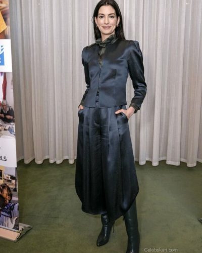 Anne Hathaway stylish teal high neck gown with a sleek fit