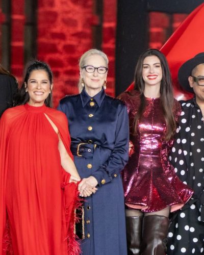 Anne Hathaway colorful dress paired with statement accessories