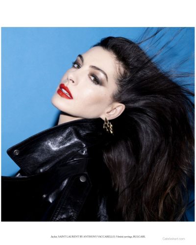 Anne Hathaway in sleek black waistcoat with glossy finish.