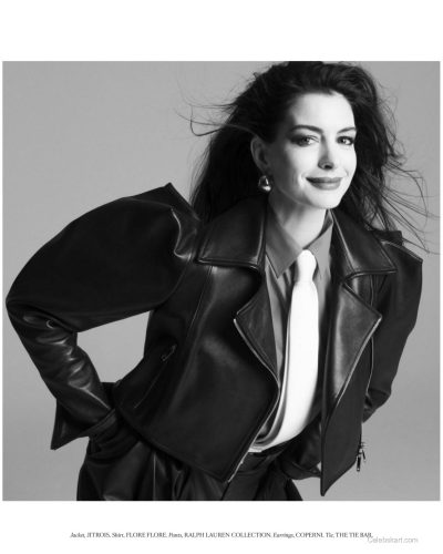 Anne Hathaway in contemporary black waistcoat and cascading waves.