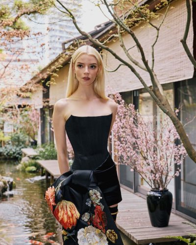 Anya Taylor-Joy black floral gown with a dramatic trailing sash