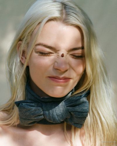 Anya Taylor-Joy light gown with subtle edgy accessories