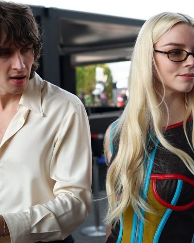 Anya Taylor-Joy wearing a vibrant top and glossy leather pants