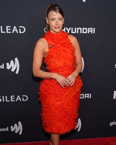 Ariana Madix vibrant orange dress with feather detailing
