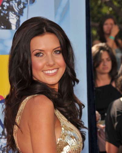 Audrina Patridge flowing knee-length golden gown with fine pleats