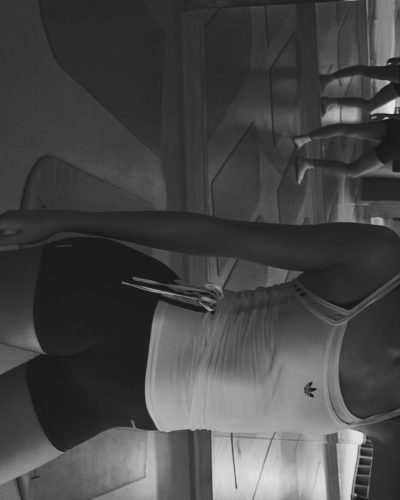 Ava Michelle in chic monochrome ensemble with sleek accessories.