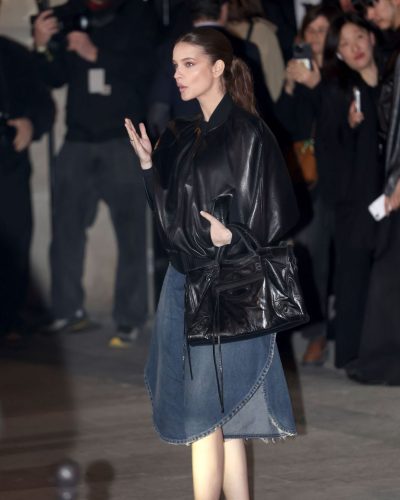 Barbara Palvin black bomber jacket and denim skirt combination