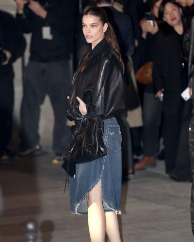 Barbara Palvin black bomber jacket paired with denim skirt