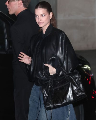 Barbara Palvin black bomber jacket styled with chic denim skirt