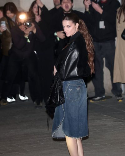 Barbara Palvin chic black bomber jacket with asymmetrical denim skirt