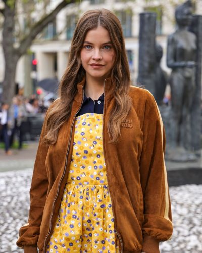Barbara Palvin in a casual brown bomber jacket and dress