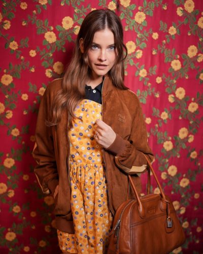 Barbara Palvin wearing a colorful floral dress with flower patterns