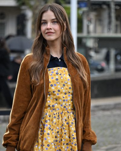 Barbara Palvin sporting a yellow floral dress and brown jacket