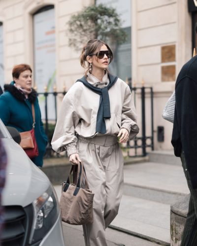 Barbara Palvin styled in a beige jacket and structured trousers.