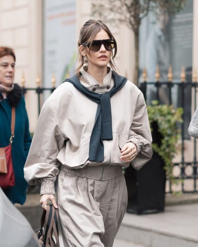 Barbara Palvin in a beige tailored jacket and wide-leg pants.