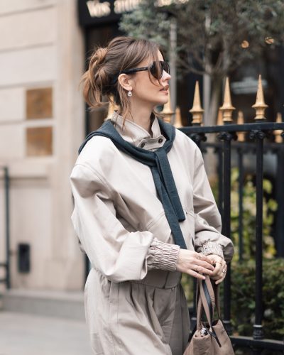 Barbara Palvin with a navy scarf and beige trousers.