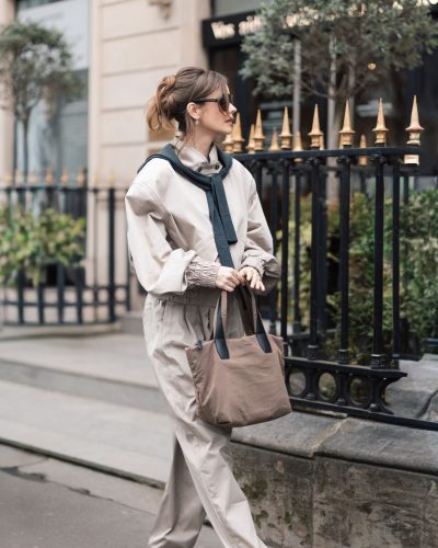 Barbara Palvin in a relaxed beige jacket and tailored trousers.