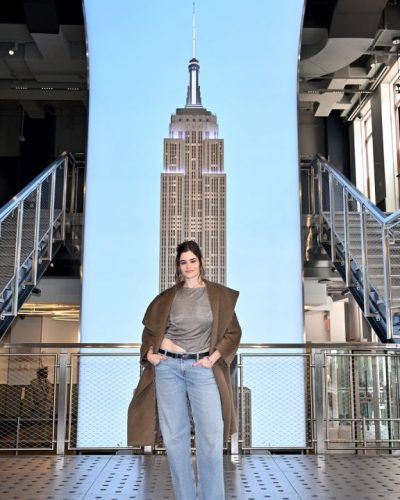 Barbie Ferreira relaxed updo hairstyle with strands framing her face.