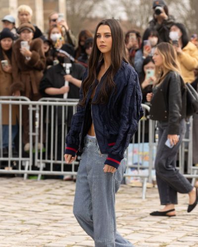Beau Gadsdon in a casual navy bomber and dressy light blue skirt.