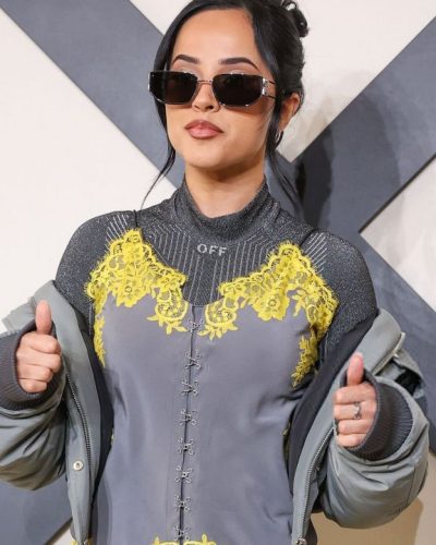 Becky G in silver pointed-toe heels