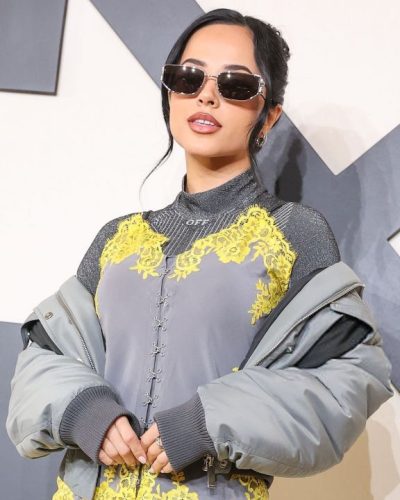 Becky G styled in mid-thigh grey dress