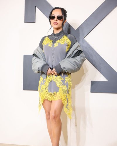 Becky G with vibrant personality in grey dress