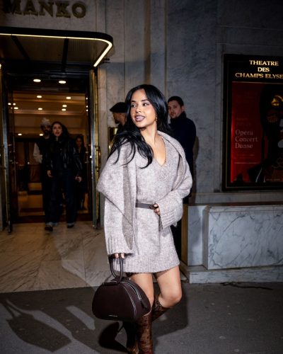 Becky G in casual chic beige dress and handbag