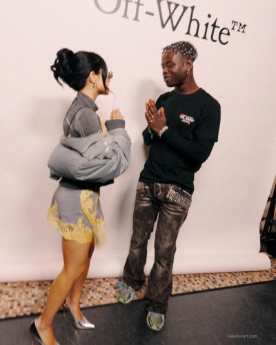 Becky G fashionable gray gown with lace accents