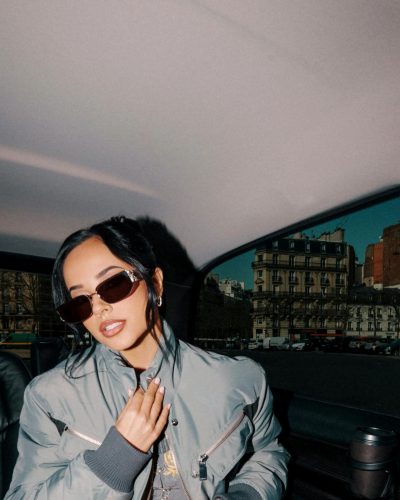 Becky G playful energy in oversized bomber jacket