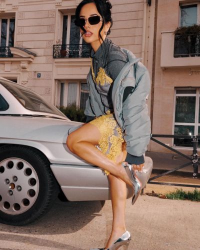 Becky G vibrant yellow lace against gray fabric