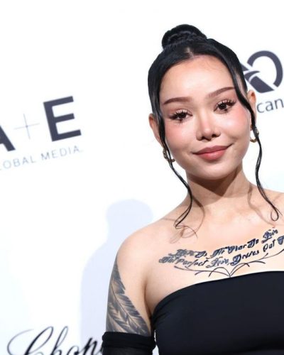 Bella Poarch in stylish black gown with soft tendrils hairstyle