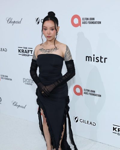 Bella Poarch in black strapless gown with sheer sleeves