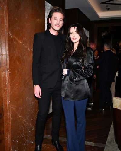 Bella Thorne black satin blazer and dark blue top