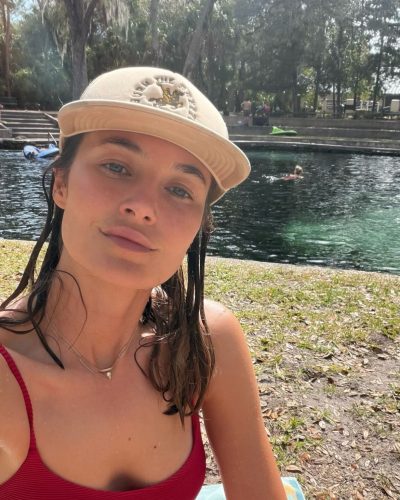 Bridget Malcolm in black bikini, perfect for summer activities.