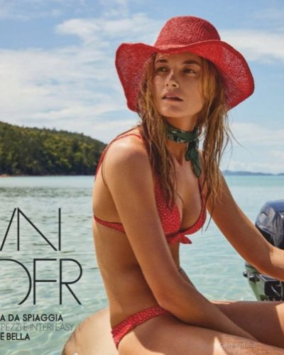 Bridget Malcolm in simple black bikini with minimalist accessories.