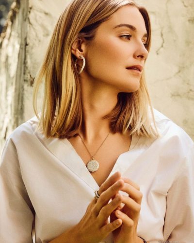 Bridget Malcolm in black bikini, sun-kissed and carefree.