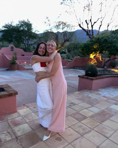 Brittany Snow wearing a blue dress with a flowing silhouette