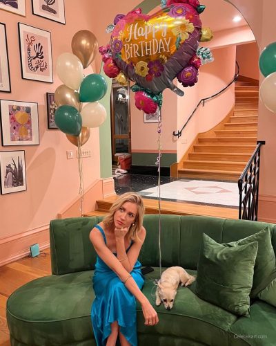 Brittany Snow in a chic blue dress paired with minimal accessories