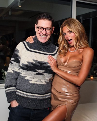 Brooks Nader in body-positive beige dress with side slit